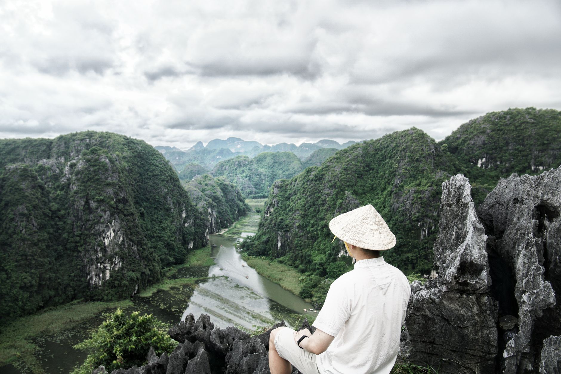 Traveler looking over mountain landscape