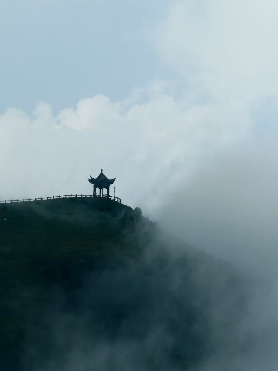 Misty forested mountains and wooden shrines
